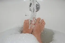 Letting feet sit in hot water is bad for good total foot care. 
