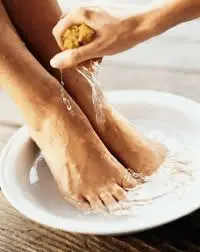 Wash feet thoroughly as good and healthy practice of good total foot care.